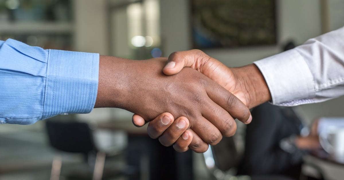 Two professionals shaking hands